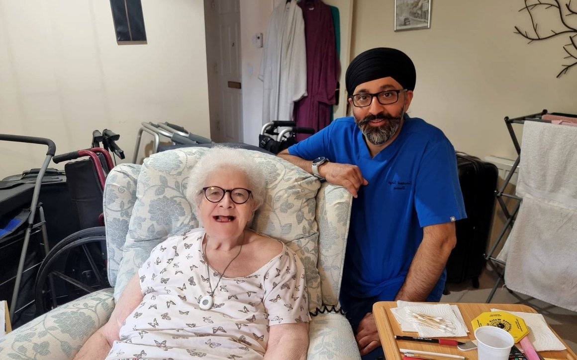 Mobile dentist caring for a patient at home in Manchester